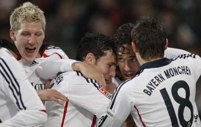 Toni celebrates with teammates after scoring