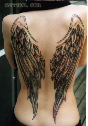 heart and wings tattoo. Heart with halo and wings